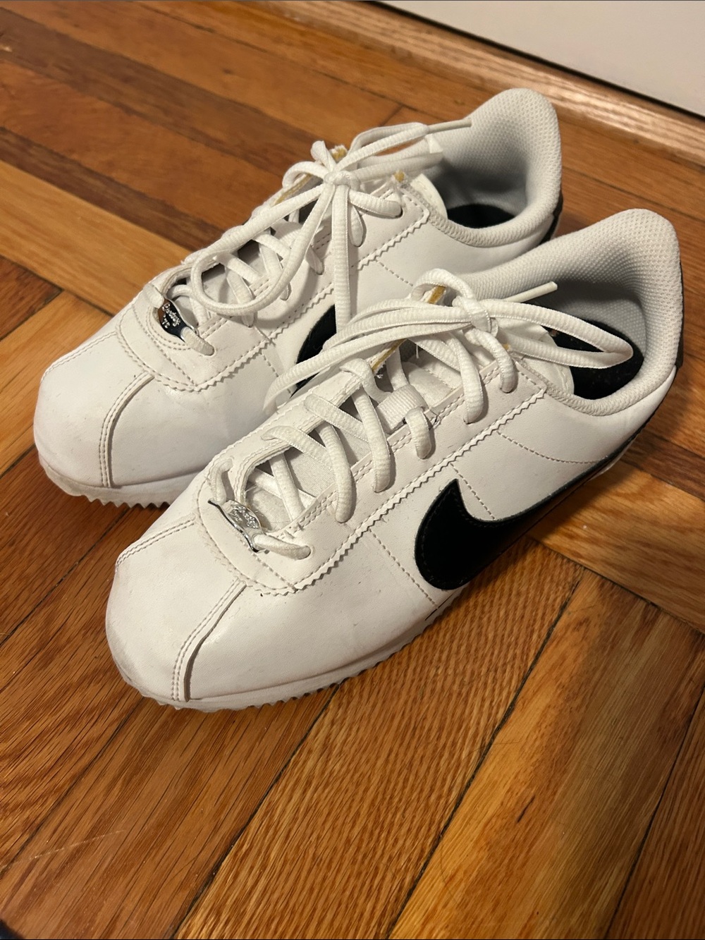 Nike Cortez Kids White Sneakers with Black Swoosh